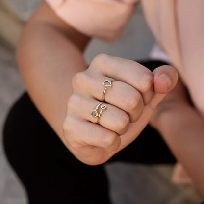Anillo Oro 18 Quilates Gemini Topacio y Peridoto